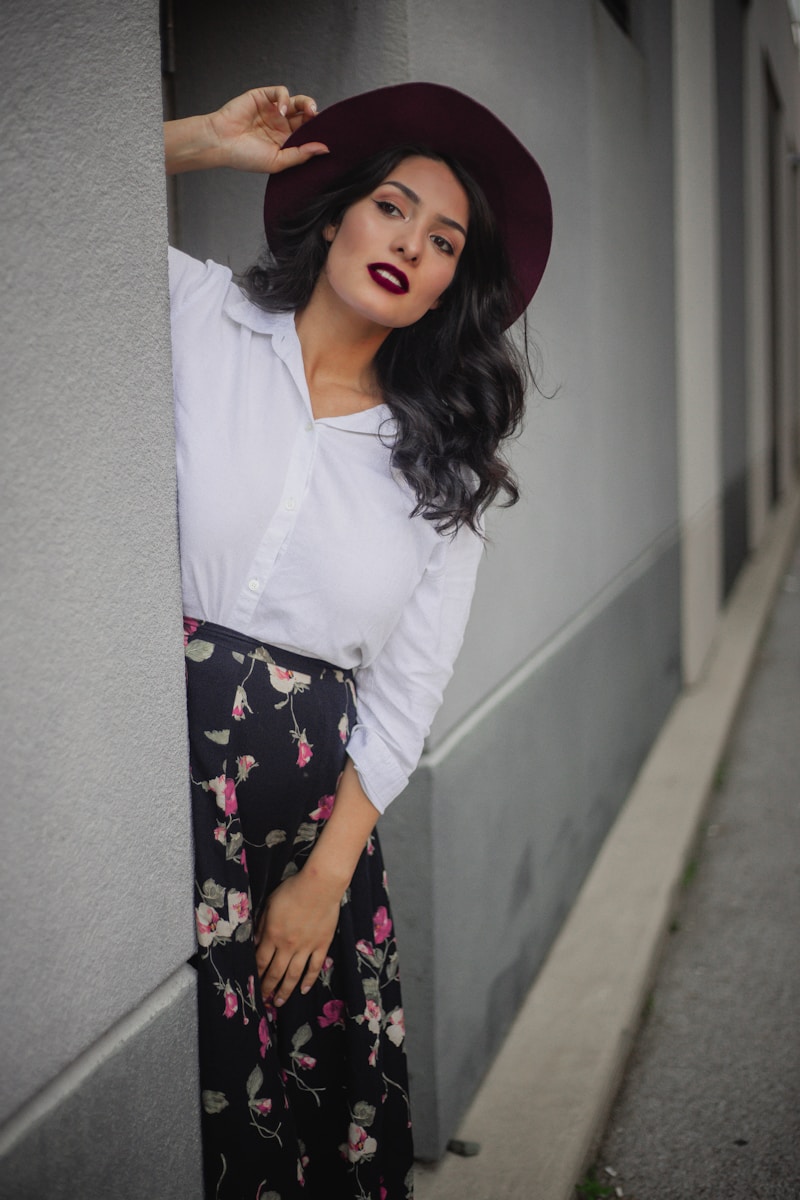 Photo by Jennifer Marquez woman in white long sleeve shirt and black floral skirt