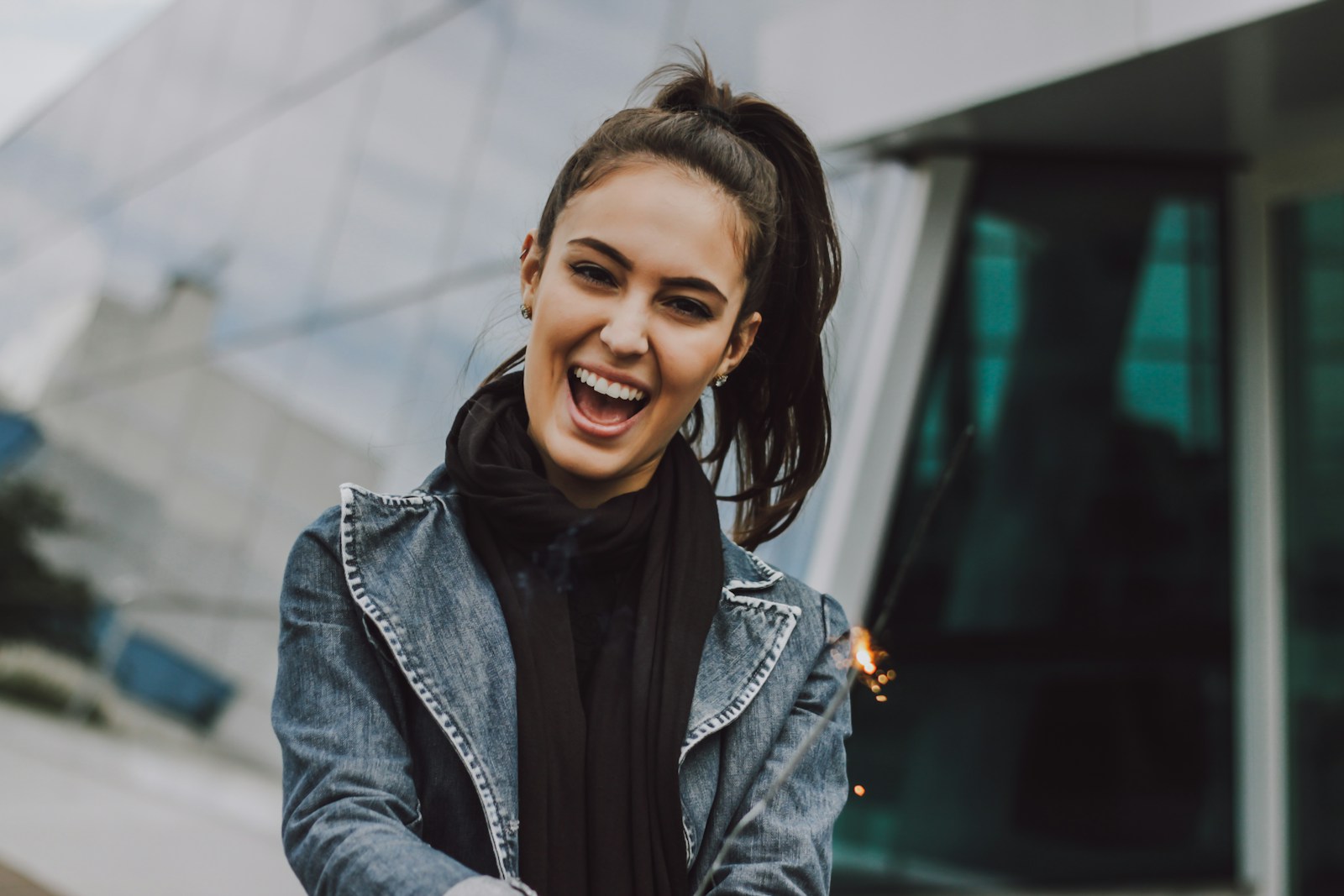 Photo by Vinicius Wiesehofer woman wearing gray denim jacket and black scarf