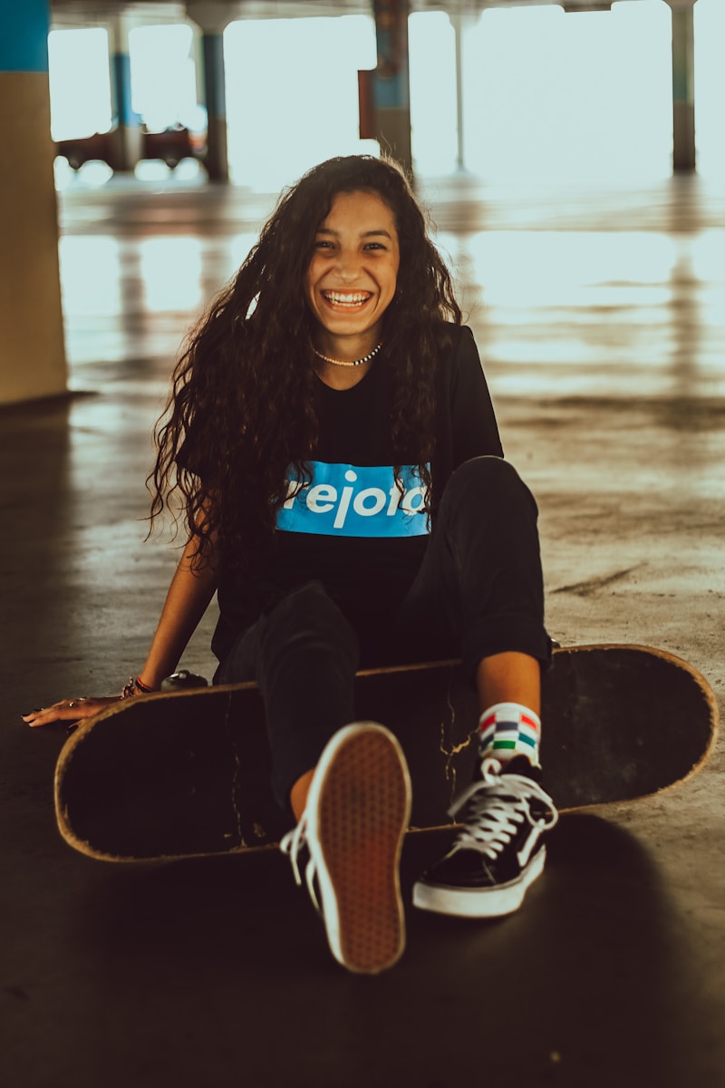 Photo by Gabriel Brito a person sitting on a dock