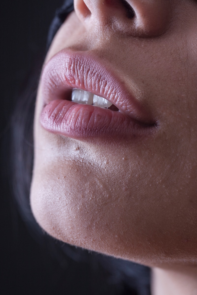 Photo by engin akyurt person with red lipstick and black mascara